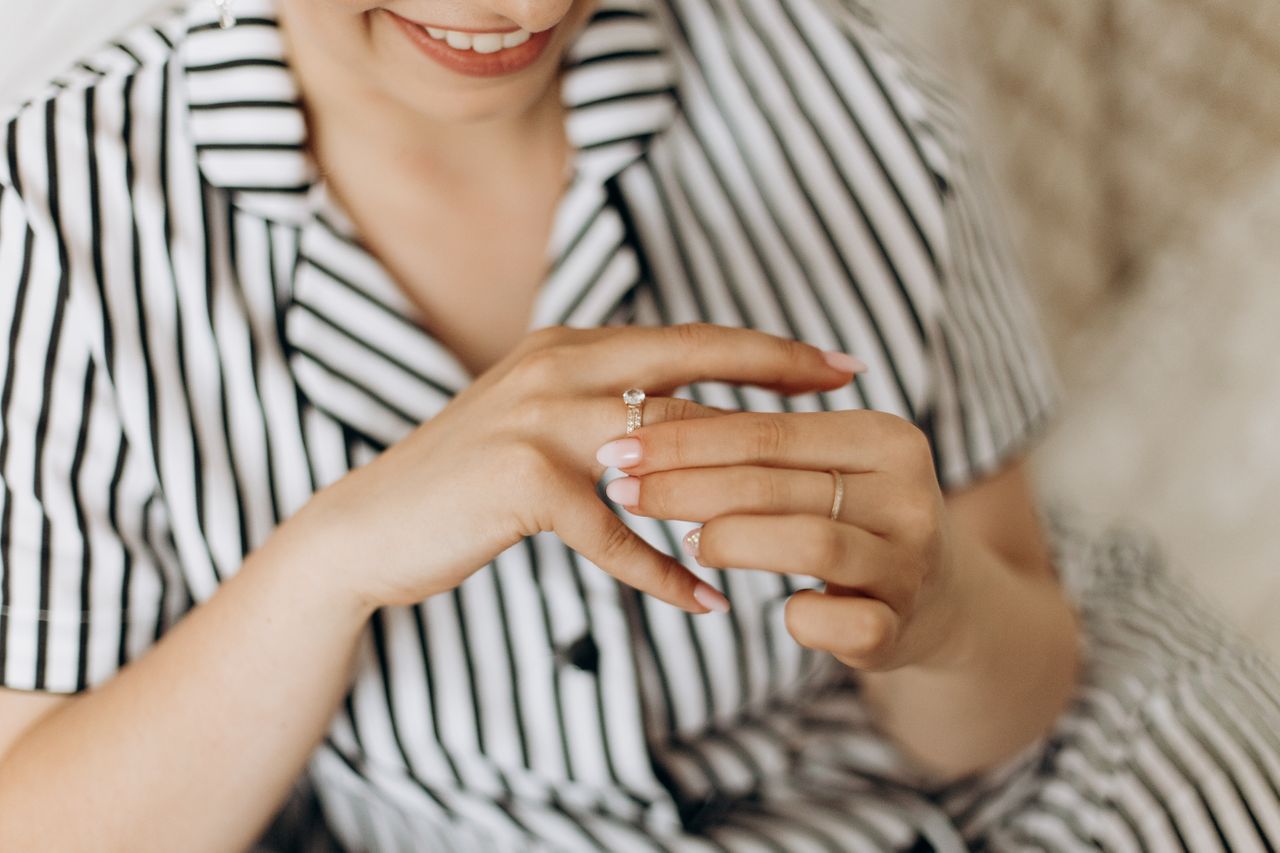 Diamond engagement ring admired by woman